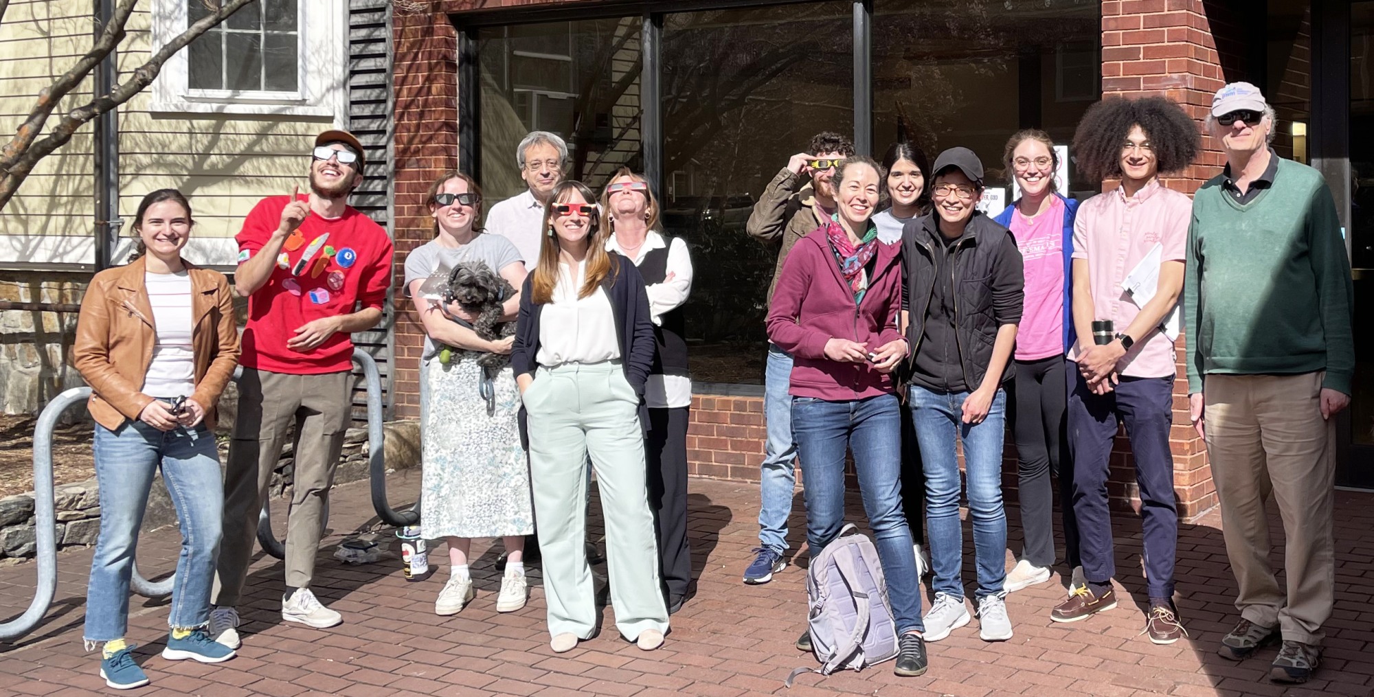 Faculty, staff and graduate students in front of Kassar House
